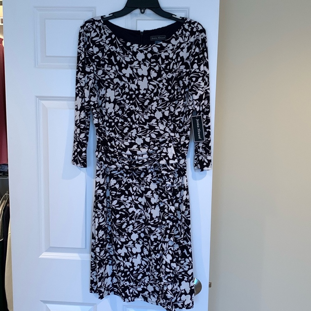 Black and white dress, accent around middle with ruffle from waist down, size 14